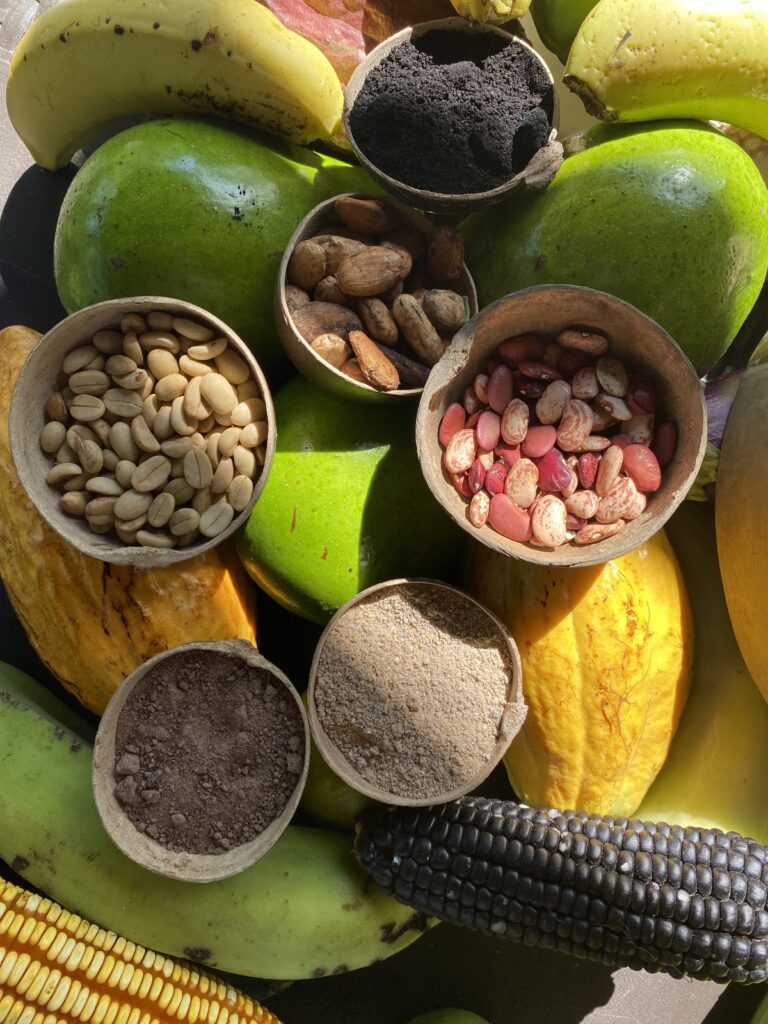 fruits and nuts and corn on a table, colourful arrangement of food