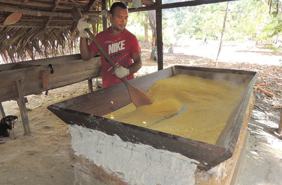 Man stirring cassava